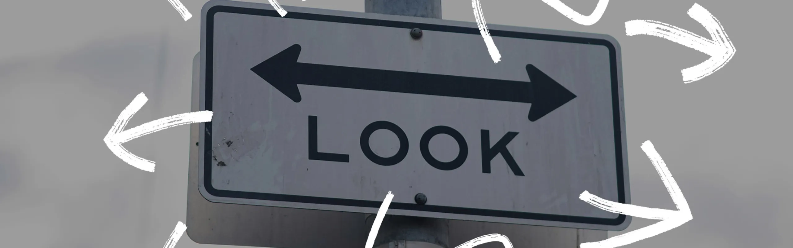 Look sign with arrows pointing in various directions.