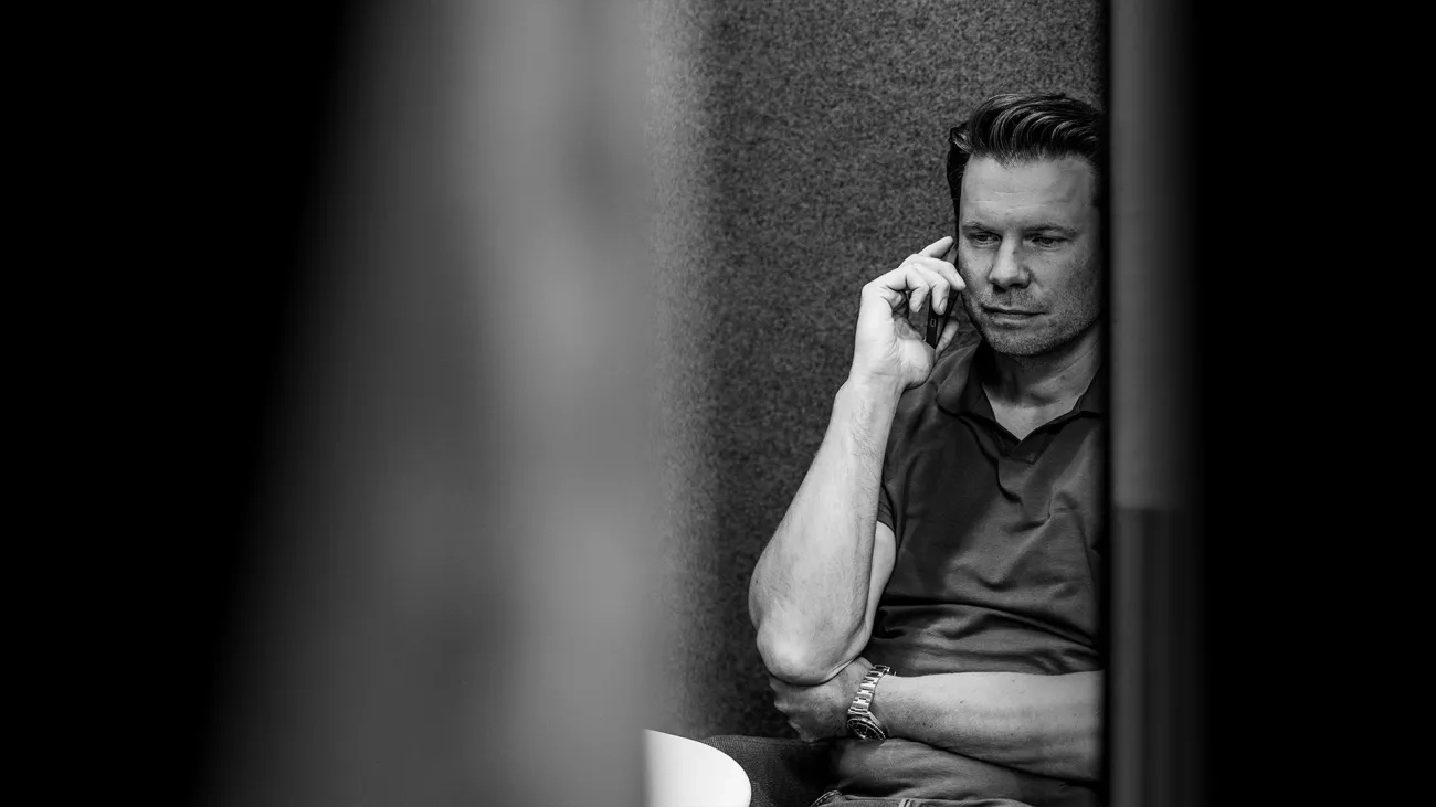 Man sitting and talking on the phone
