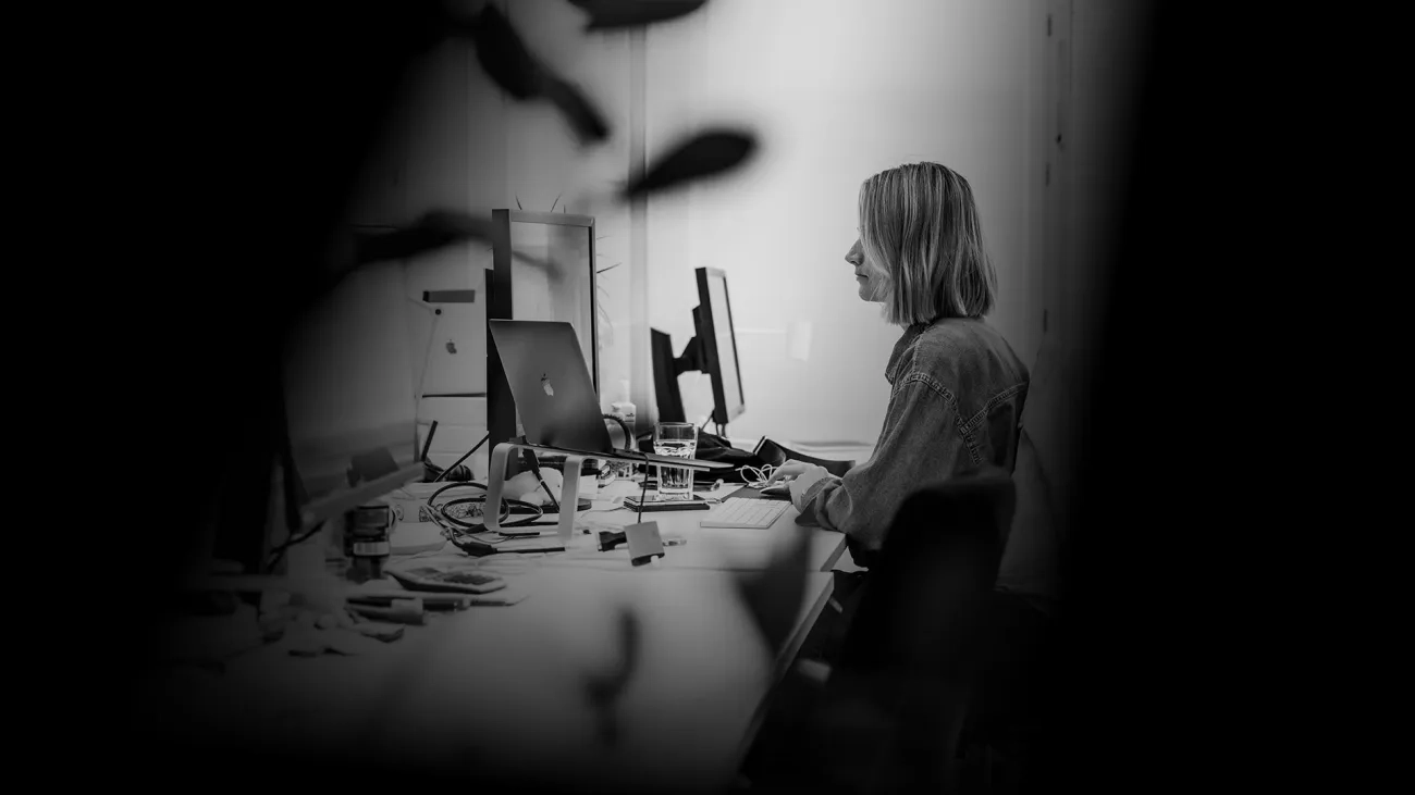 Woman sitting at an office in front of her computer
