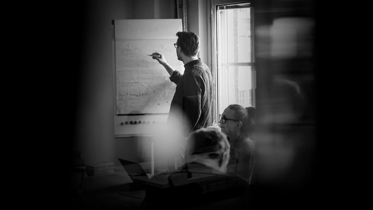 Man sketching on a whiteboard