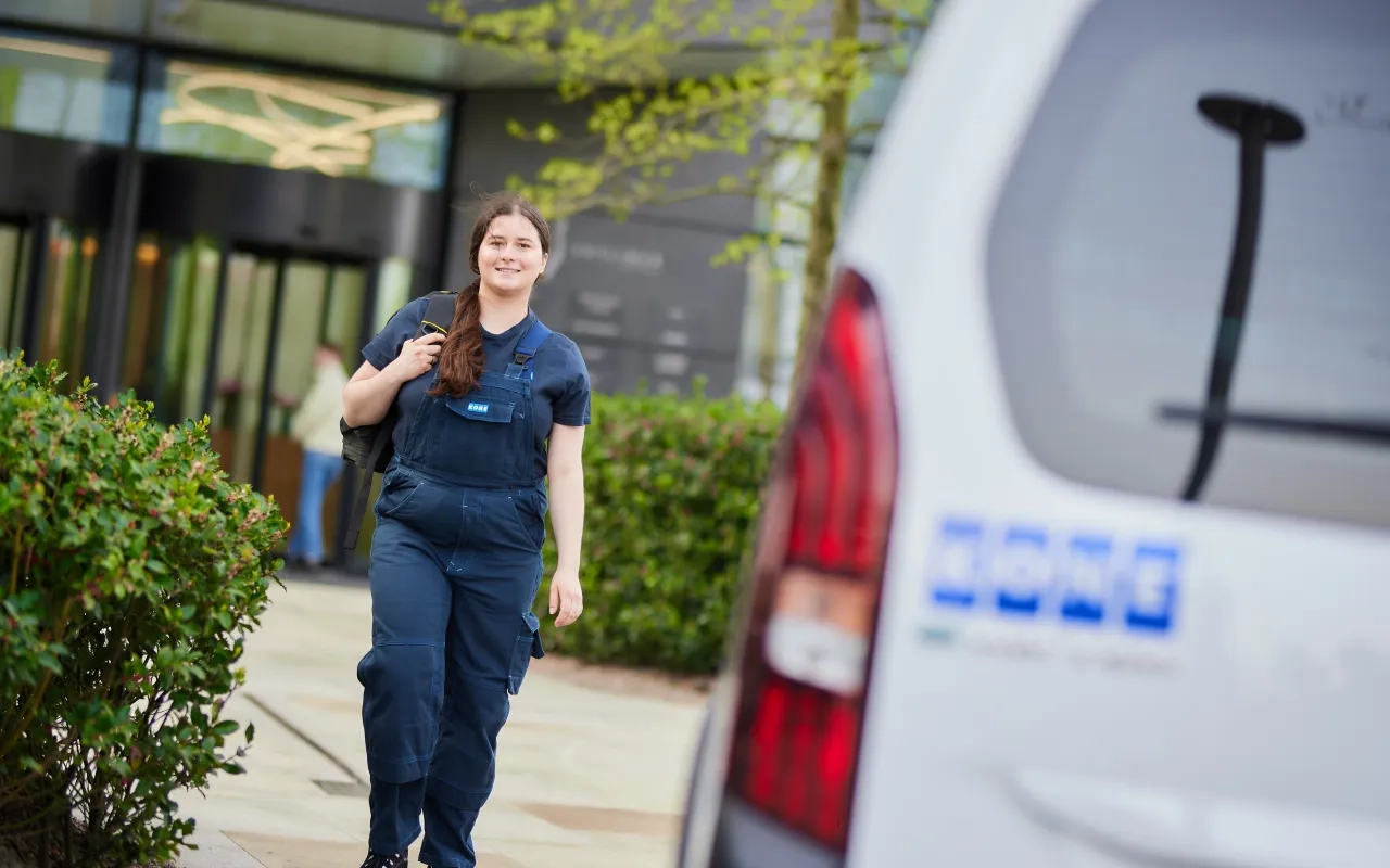 Woman approaching KONE service car